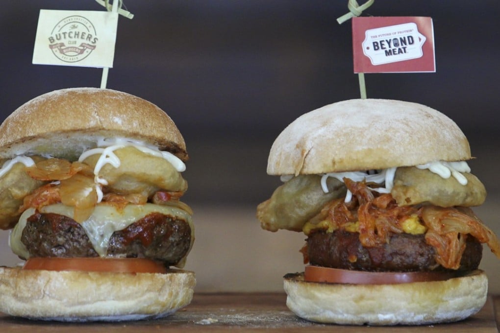 A plant-based Wu Tang-style burger (right) and its meat equivalent from Hong Kong chain Butchers Club. Photo: Roy Issa