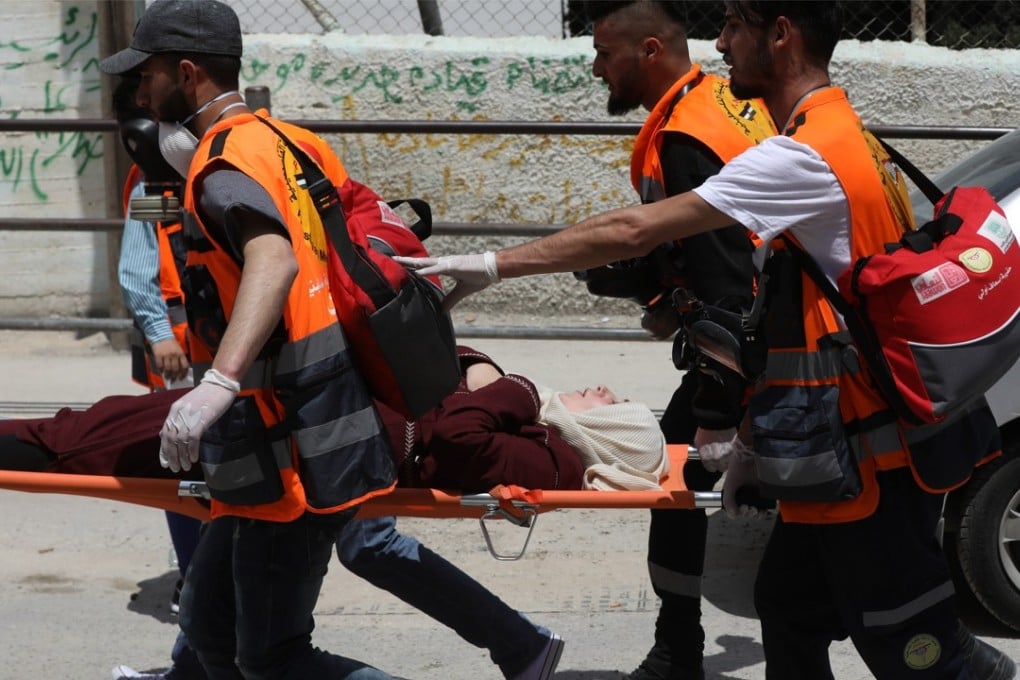 A wounded Palestinian demonstrator is evacuated during a protest on Monday. Photo: EPA-EFE