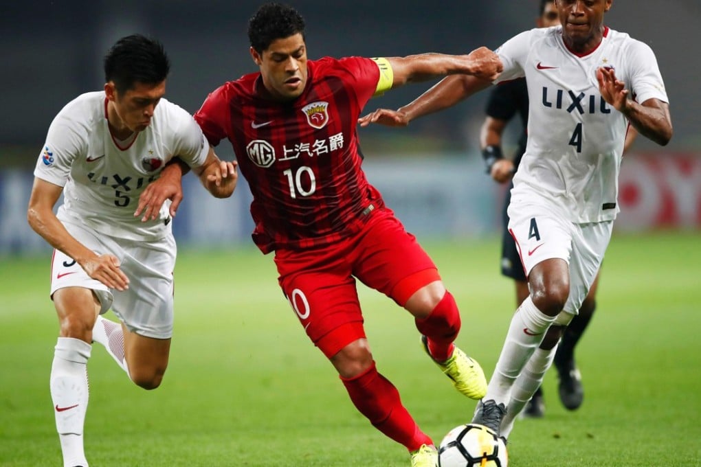 Shanghai SIPG’s Hulk battles for the ball during the AFC Champions League aggregate loss to Kashima Antlers. Photo: AFP