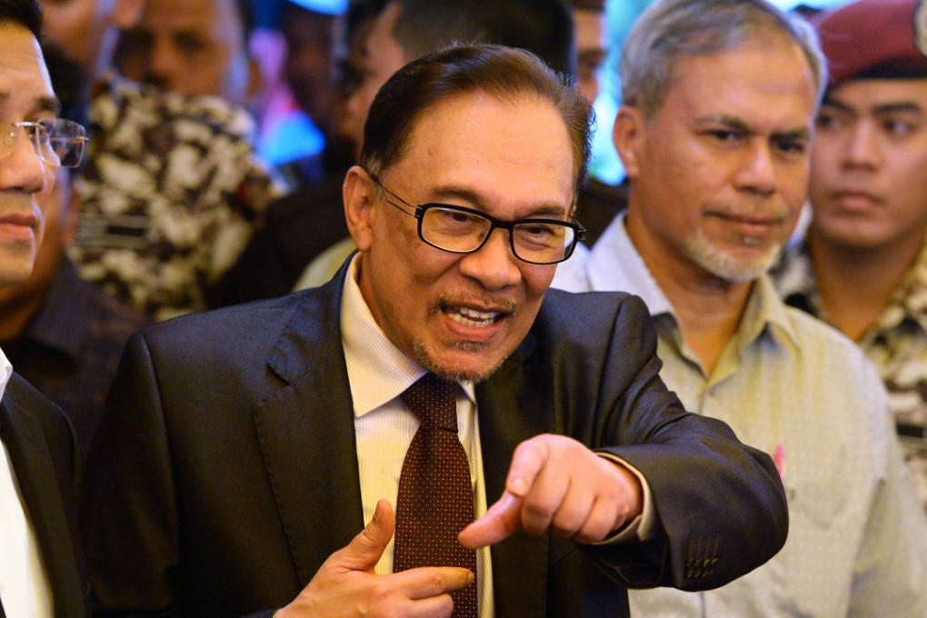 Anwar Ibrahim gets ready to speak to the media in Kuala Lumpur on May 16. Anwar walked free after receiving a royal pardon, paving the way for his return to national politics as the presumptive successor to Prime Minister Mahathir Mohamad. Anwar was serving a five-year jail term on charges of sodomy he says were trumped up by the ousted premier, Najib Razak. Photo: AFP