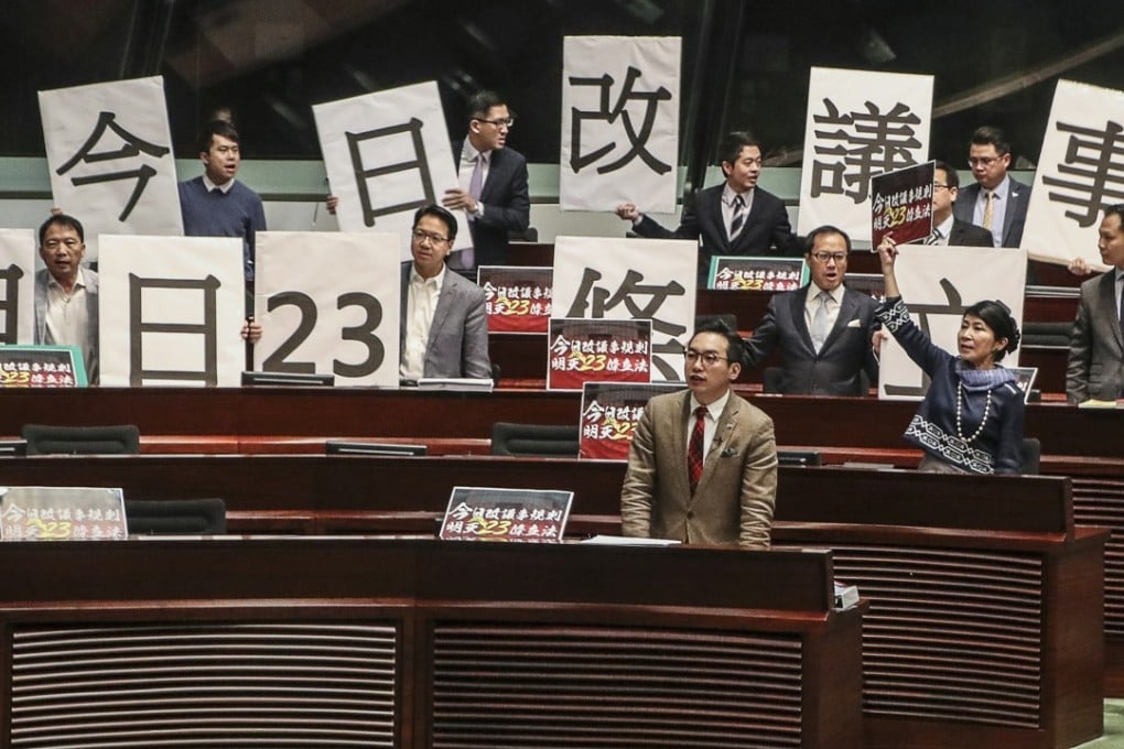 Pan-democrat lawmakers stage a protest during a Legislative Council meeting to debate rule changes, on December 7, 2017. The dramatic debate saw days of antagonism, with 11 opposition legislators removed from the chamber before the changes were passed on December 15. Photo: K.Y. Cheng