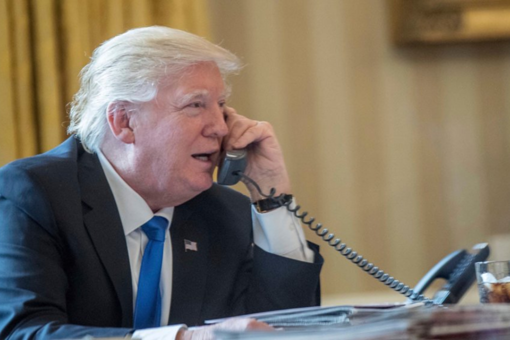 President Donald Trump speaks on the phone in the Oval Office on Jan. 28, 2017. Photo: Associated Press/Andrew Harnik