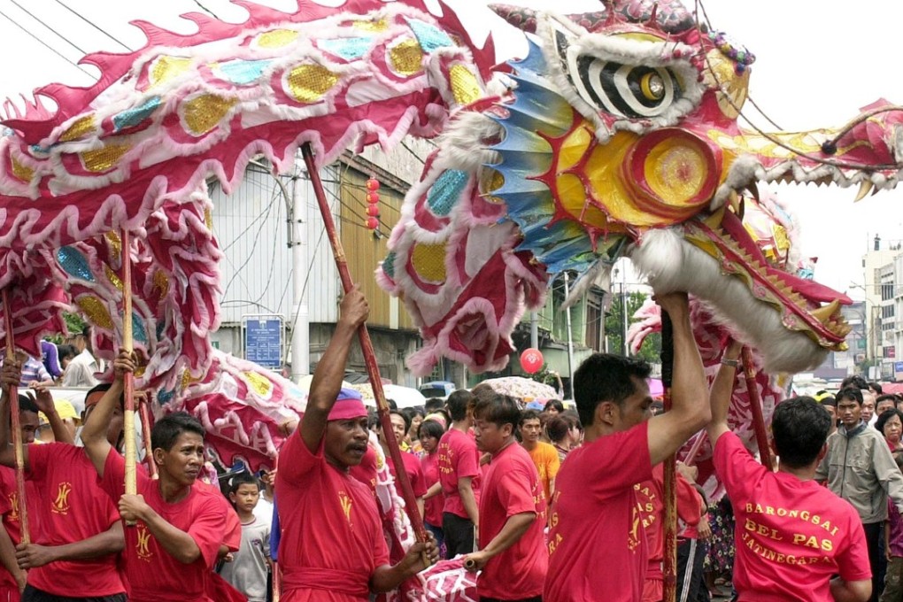 Ethnic Chinese Indonesians perform a dragon dance in Jakarta. Under Suharto, celebrating Chinese culture was banned. Photo: AFP