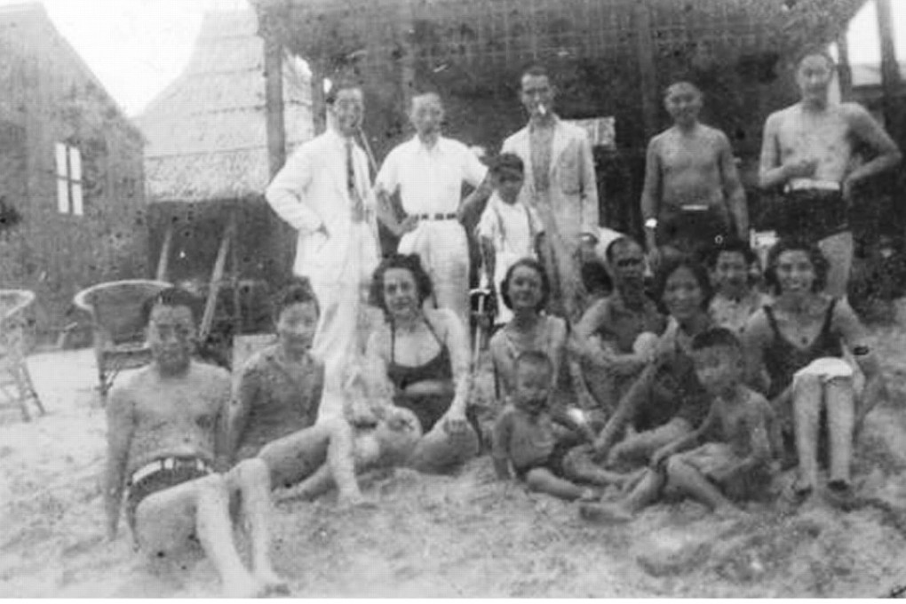 A party at Repulse Bay in 1939 organised for the staff and writers of T’ien Hsia magazine, including chief editor Wen Yuan-ning (standing, centre), Lesley Chan (standing second from right) and poet Shao Xunmei (standing far right). Seated (from left) are Chuan Tsen-kuo, his sister Mei-Mei, writer Emily Hahn, Arthur “Paddy” Gill (fourth from right), Chan’s wife Mildred (with their two children) and Louise Mary Newman (second from right). Picture: courtesy of the Gill family