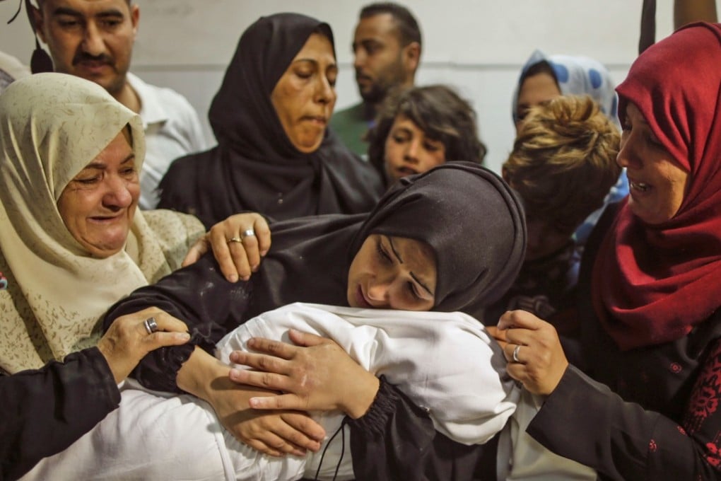 A Palestinian mother weeps for her child who died of tear-gas inhalation during clashes in East Gaza, at a hospital morgue in Gaza City on May 15. Photo: AFP
