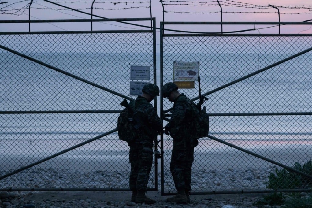 South Korean soldiers lock the entrance to a beach on Yeonpyeong island, near the Northern Limit Line with North Korea, on April 24. Photo: AFP