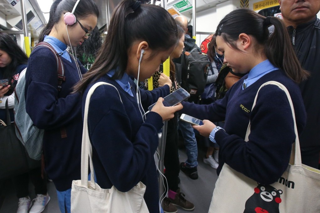With emoji replacing facial expressions and texting the preferred mode of conversation, real-world language skills of youngsters may suffer. Photo: David Wong
