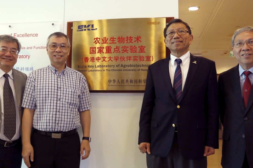 Chinese University of Hong Kong professor Lam Hon-ming (second left) with colleagues at their laboratory. Photo: Tory Ho