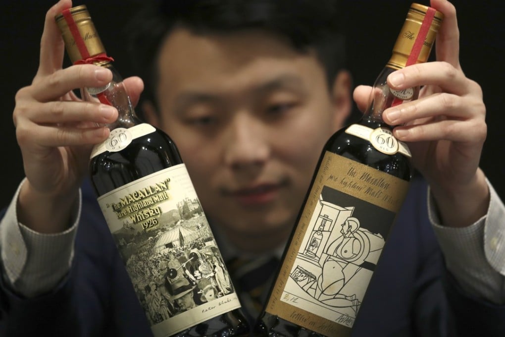Two bottles of rare, 60-year-old Macallan whisky set a world record on Friday night when they were auctioned for a total of HK$16.6 million (US$2.11 million). Photo: Nora Tam