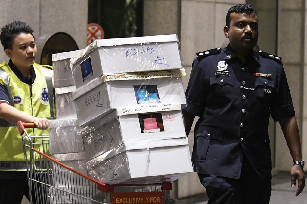 Boxes seized by police from Pavilion Residents, Kuala Lumpur, a flat owned by former prime minister Najib Razak. Photo: EPA