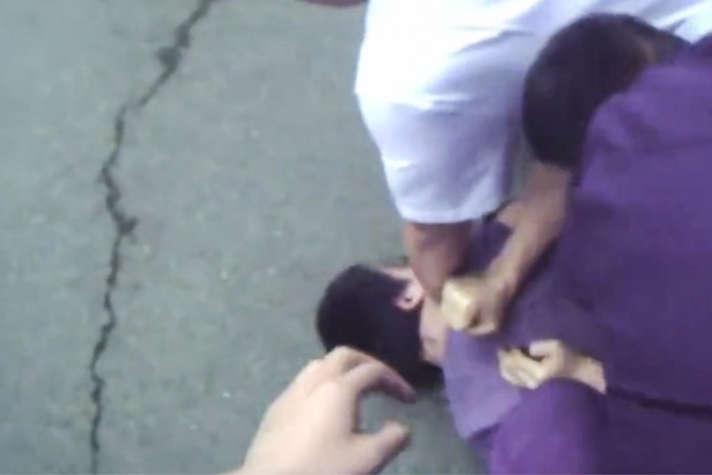 Beijing’s law enforcement authority on Friday insisted the Hong Kong video journalist who was handcuffed and dragged into a police van while bleeding had resisted police authority. Photo: Handout