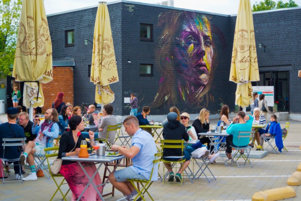 Digital nomads enjoy the terrace at Telliskivi Creative City, in Tallinn, Estonia. Picture: Alamy