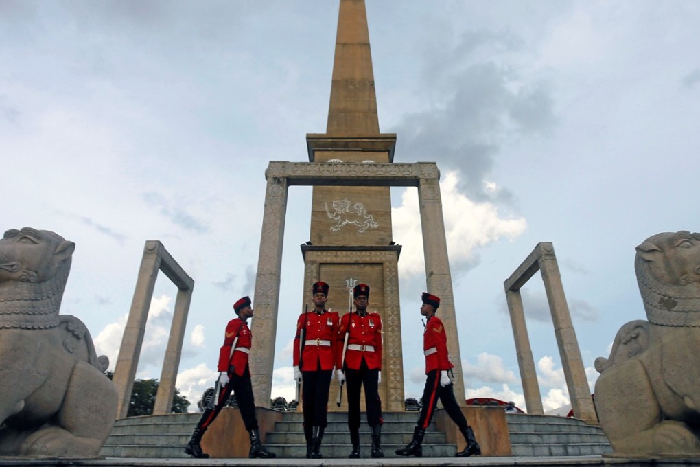 Sri Lankan army members march in front of the war heroes’ in Colombo. Photo: Reuters