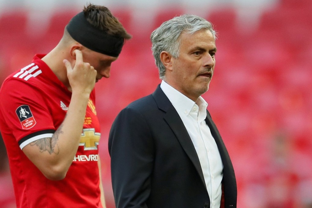 Manchester United manager Jose Mourinho and defender Phil Jones look dejected after their loss to Chelsea in the FA Cup final. Photo: Reuters