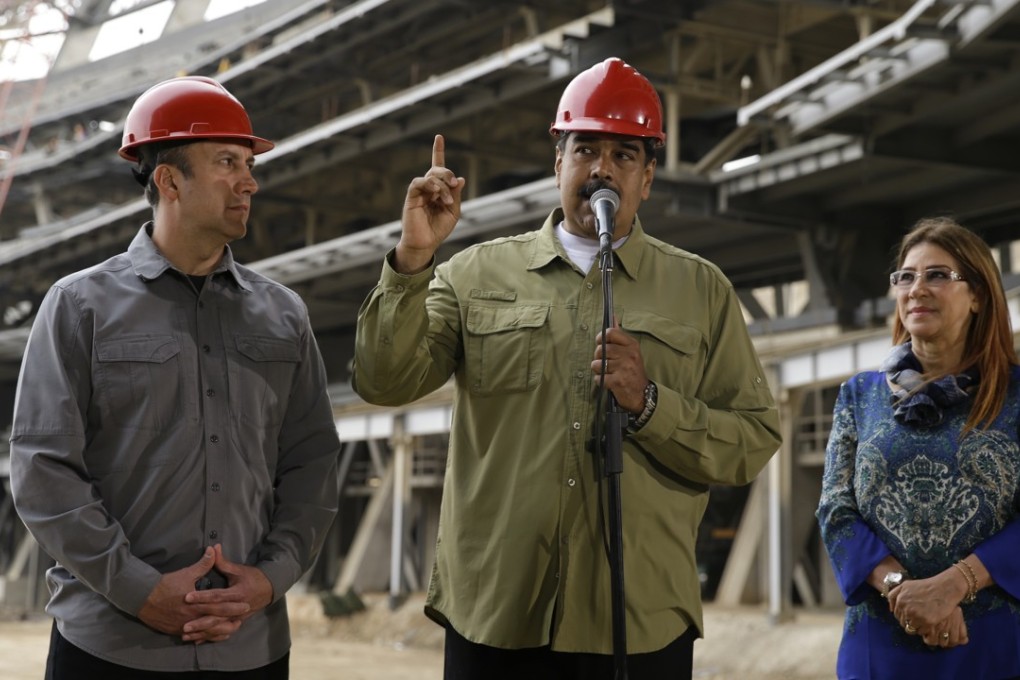 Venezuela’s President Nicolas Maduro, his wife Cilia Flores and Vice-President Tareck El Aissami, during a tour of a baseball stadium being built on the outskirts of Caracas. Photo: AP