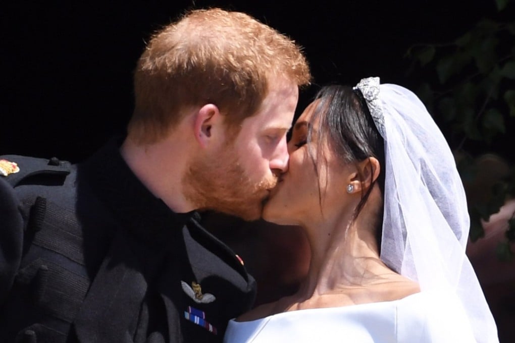 Prince Harry and Meghan Markle kiss on Saturday, May 19, 2018, in Windsor, England. Photo: pool via EPA-EFE