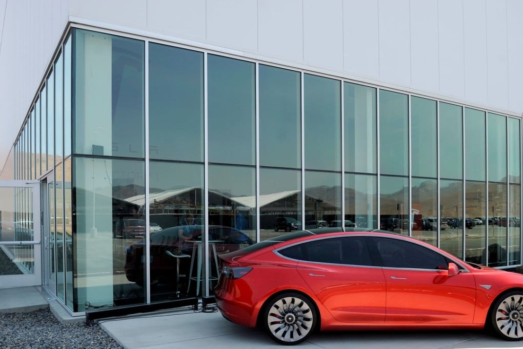 FILE PHOTO: A prototype of the Tesla Model 3 is on display in front of the factory during a media tour of the Tesla Gigafactory which will produce batteries for the electric carmaker in Sparks, Nevada, U.S. July 26, 2016. REUTERS/James Glover II/File Photo