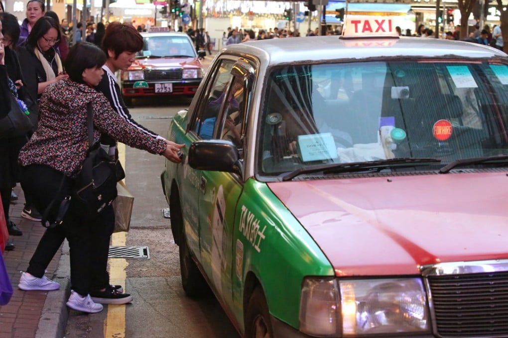 Passengers get into a taxi at the stand at Times Square in Causeway Bay, on March 20. Photo: Edmond So
