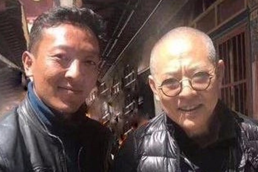 Jet Li and friend visit a temple in Tibet. Photo: Weibo