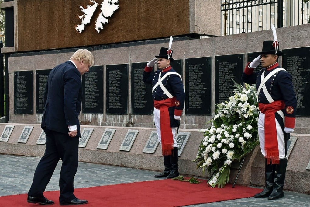 UK Secretary of State for Foreign and Commonwealth Affairs Boris Johnson (left) during a wreath-laying ceremony at the Monumento a los caidos en Malvinas in Buenos Aires on Sunday. Photo: Agence France-Presse