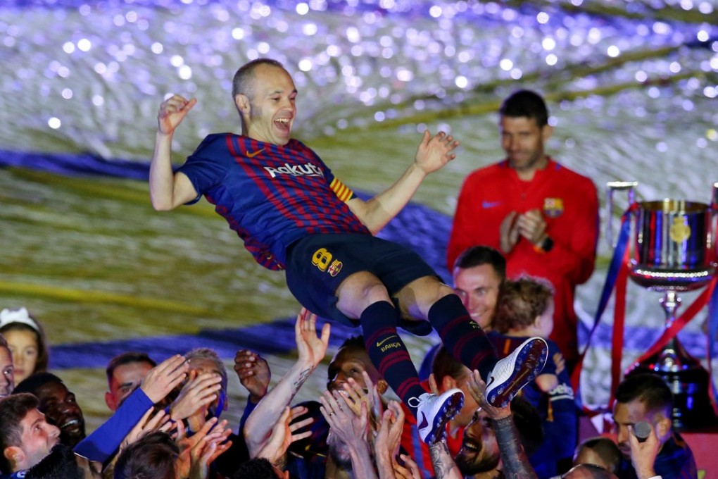 Barcelona legend Andres Iniesta and teammates celebrate after the midfielder’s final game for the club. Photo: Reuters