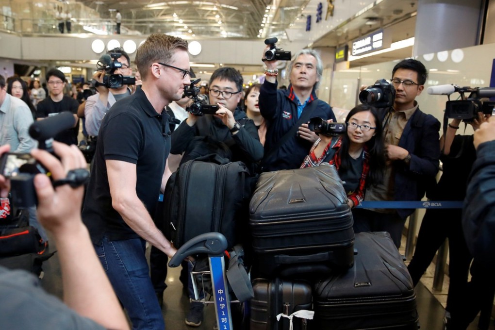 CNN's Will Ripley arrives at Beijing Capital International Airport to board a plane to North Korea. Photo: Reuters