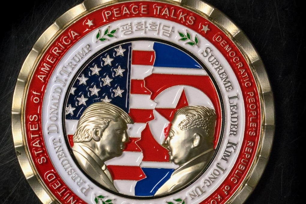 The coin depicts Trump and Kim, described as North Korea's ‘Supreme Leader’, in profile facing each other in front of a background of US and North Korean flags. PhotoL AFP