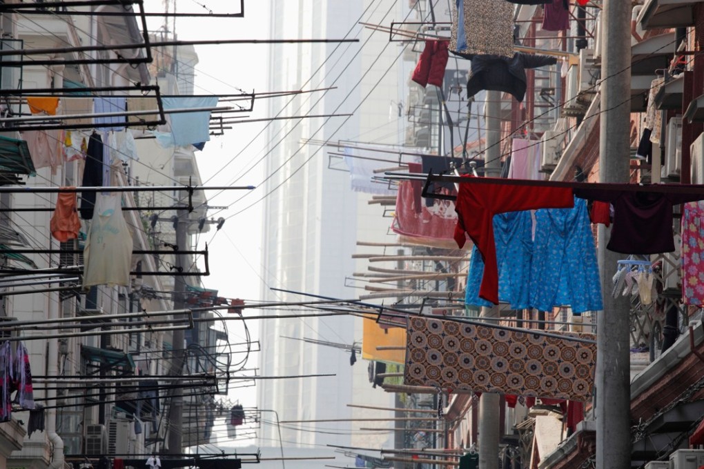 A street in Shanghai. The boost to stocks by reports that China could end its family planning policy ‘may be short-lived speculative thematic investment’ and will not last long, according to a trader. Photo: Alamy Stock Photo
