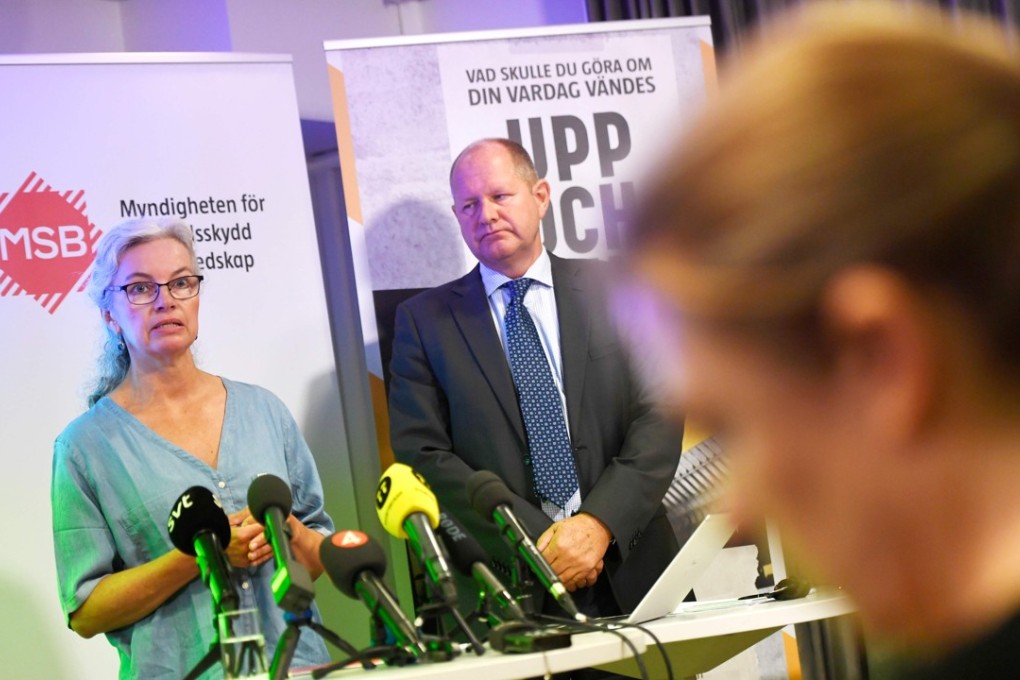 Project manager Christina Andersson and Dan Eliasson, head of the Swedish Civil Contingencies Agency, present the new brochure “If Crisis or War Comes” during a press conference in Stockholm, on Monday. Photo: Agence France-Presse