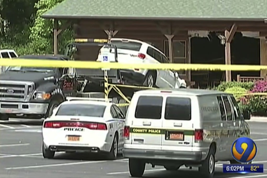 A Jeep belonging to Roger Self is seen being towed out of a restaurant after police say he intentionally rammed into the building killing his daughter and daughter-in-law. Photo: WSOC-TV 9 via AP