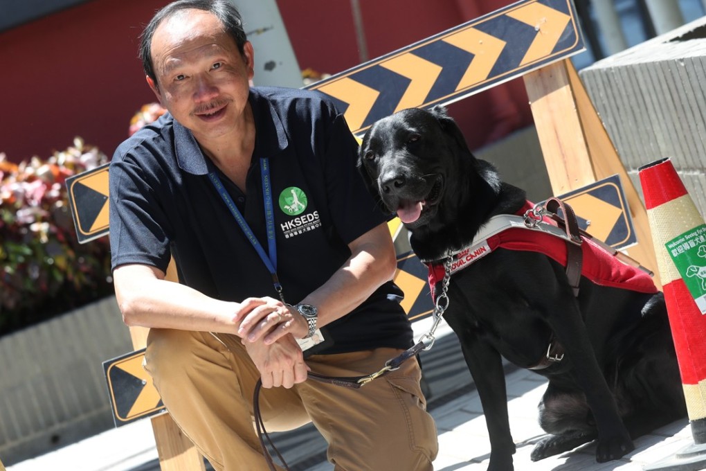 Instructor Raymond Cheung with Bruno, a guide dog in training. Photo: K.Y. Cheng