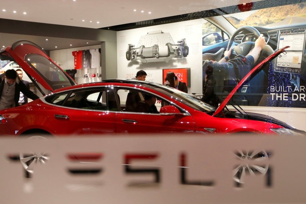 A Tesla Model S in a showroom in Beijing. The car maker said cars that had not been delivered to customers would follow the new prices, regardless of their date of customs clearance. Photo: Reuters