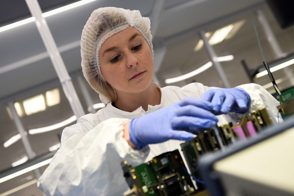 Satellite manufacturing technician Debbie Wardhaugh works at the offices of US satellite firm Spire Global in Glasgow. Photo: AFP