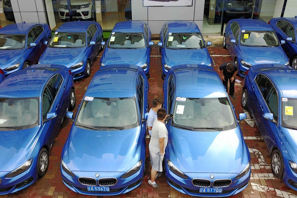 A fleet of BMW 1-Series vehicles offered by a car-sharing service in Shenyang in Liaoning province on 10 August 2017. Backed by a torrent of venture capital funds, China has seen a mushrooming of all manners of sharing platforms, from the sharing of bicycles to cars and homes, all done through mobile phone-enabled apps. Photo: AFP