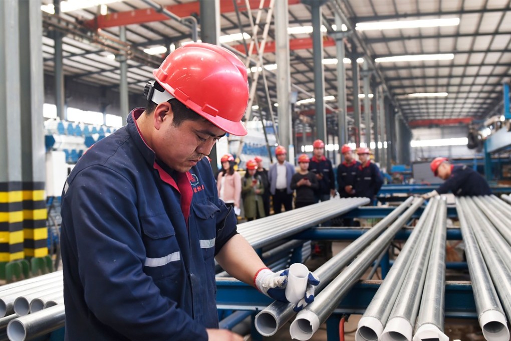 A worker checks steel pipes at a factory in Zouping, Shandong province, in April. Tariffs on steel and aluminium imports from China were Donald Trump’s opening salvo in the trade dispute between the two countries. Photo: AFP
