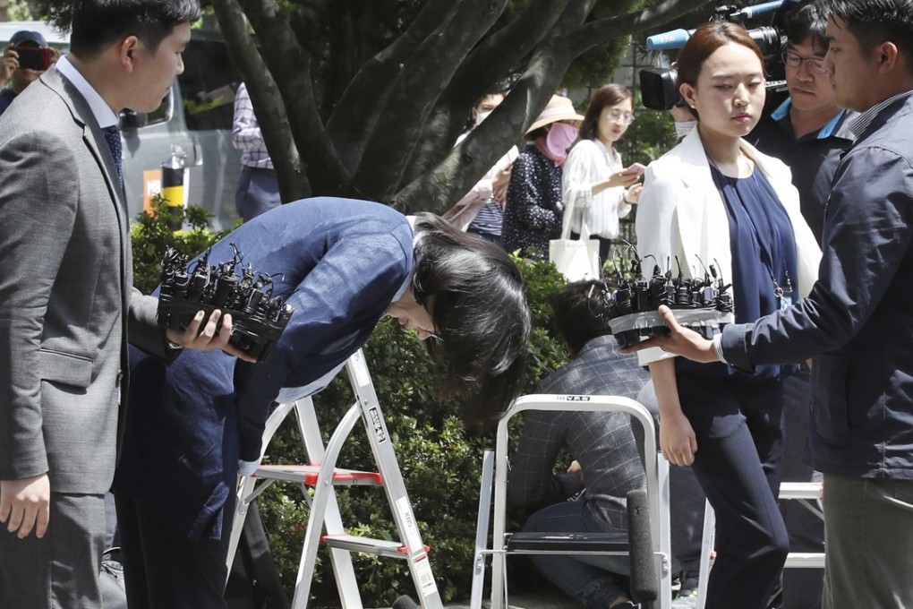 Cho Hyun-ah, centre, bows before entering a Korea Immigration Service office for questioning in Seoul. Photo: AP