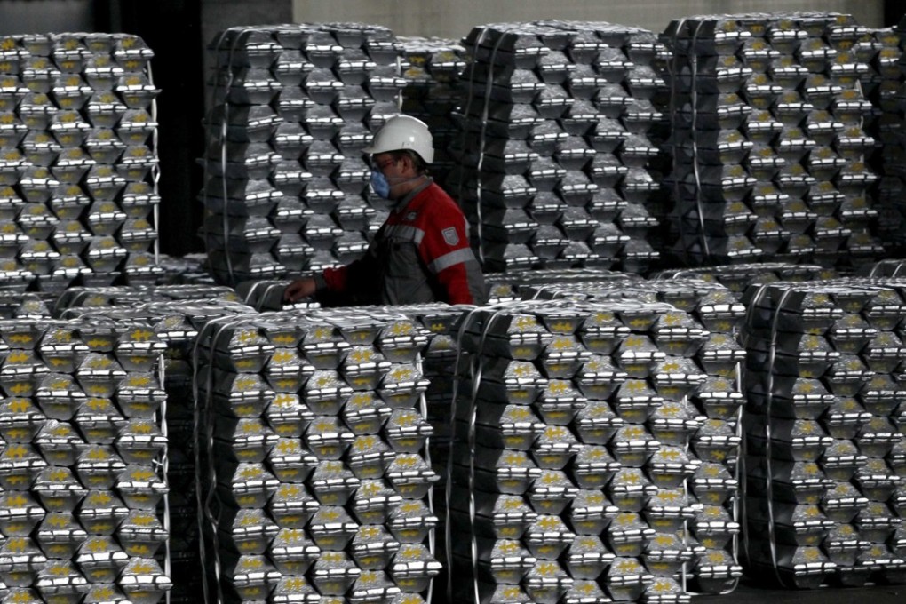 An employee marks aluminium ingots at the foundry shop of the Rusal Krasnoyarsk aluminium smelter in the Siberian city of Krasnoyarsk. Photo: Reuters