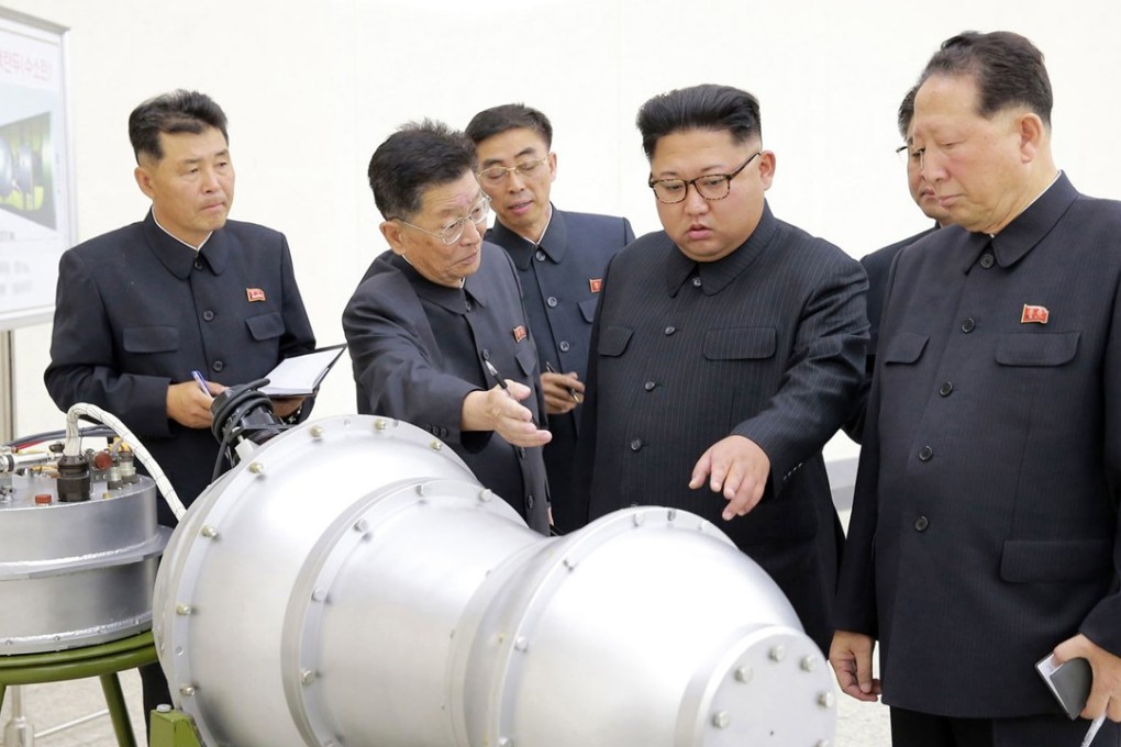 A file picture released by the North Korean news agency last September showing the country’s leader, Kim Jong-un (second right) examining a nuclear device. Photo: Associated Press