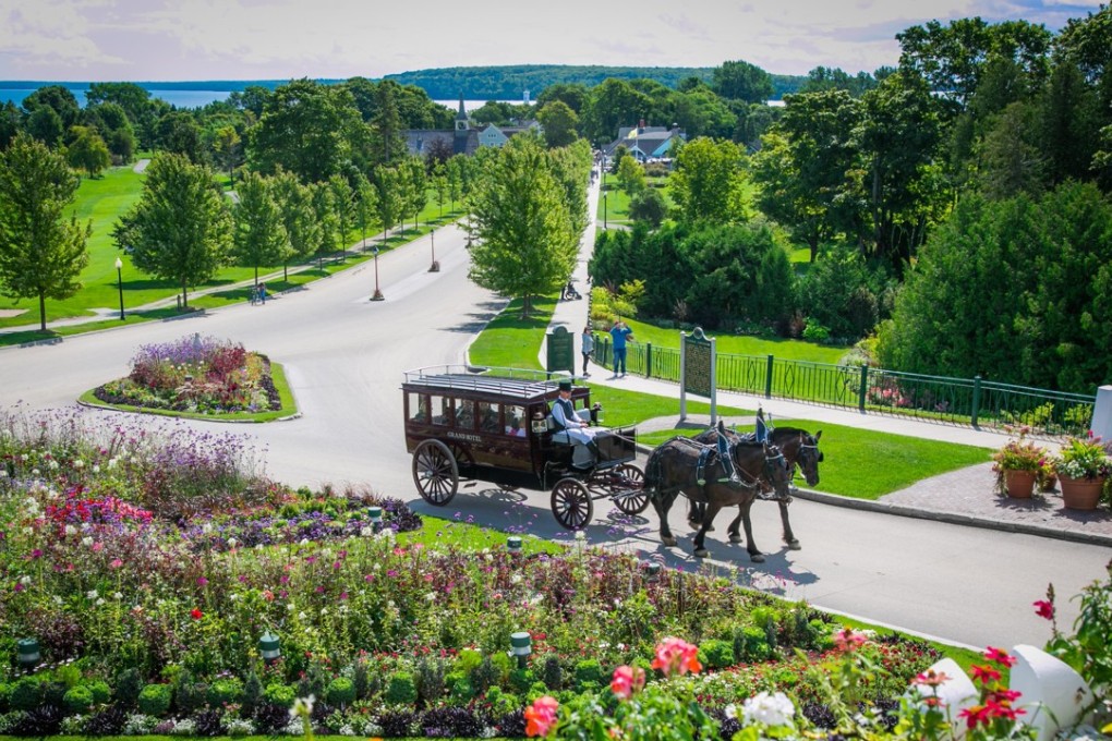 The gardens at the at the Grand Hotel are best explored from the comfort of a horse-drawn carriage. Picture: Grand Hotel
