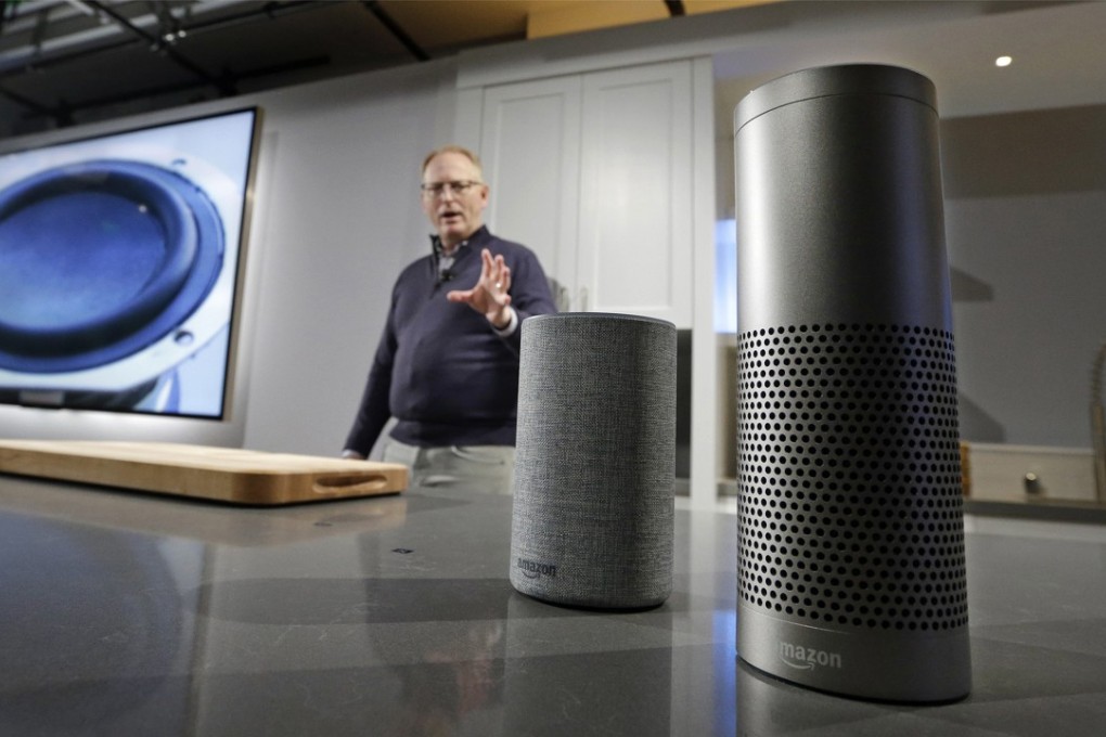 David Limp, senior vice president of Devices and Services at Amazon, displays a new Echo, left, and an Echo Plus during an event announcing several new Amazon products by the company, in Seattle. Photo: AP