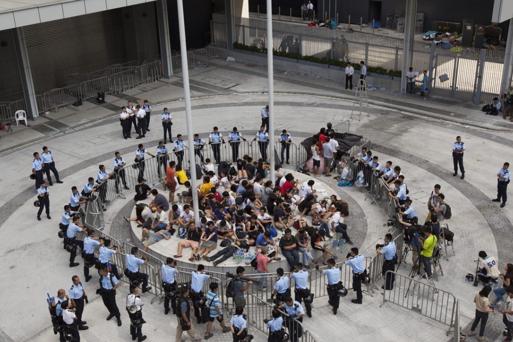 Police surround student protesters after they occupied Civic Square, the public area in front of the government headquarters, in Admiralty on September 27. The students occupied the area as part of a weeklong protest against Beijing’s rules for Hong Kong elections. Photo: EPA