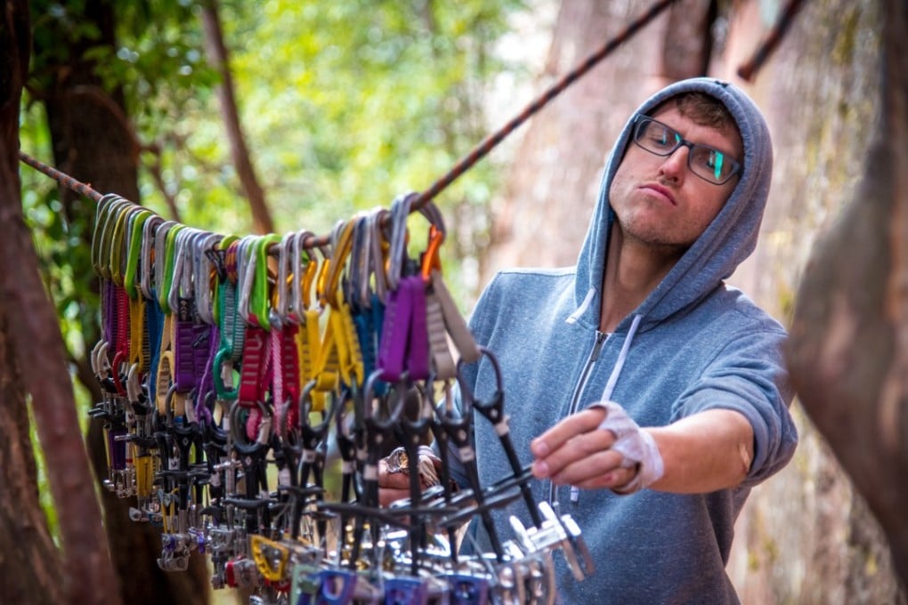 Alex Reshikov picking protection for an upcoming climb. Photo: Gary Lowther