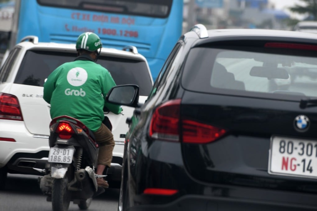 A Grab driver in Hanoi, where regulators have launched an antitrust investigation into the company. Photo: AFP