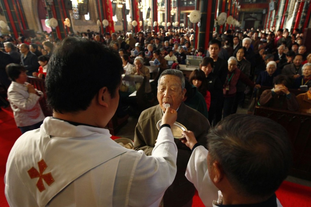 A man receives Holy Communion during an Easter Sunday mass at the state-controlled Xishiku church in Beijing. The detained Japanese may have been targeted in a crackdown on missionary work. Photo: Reuters