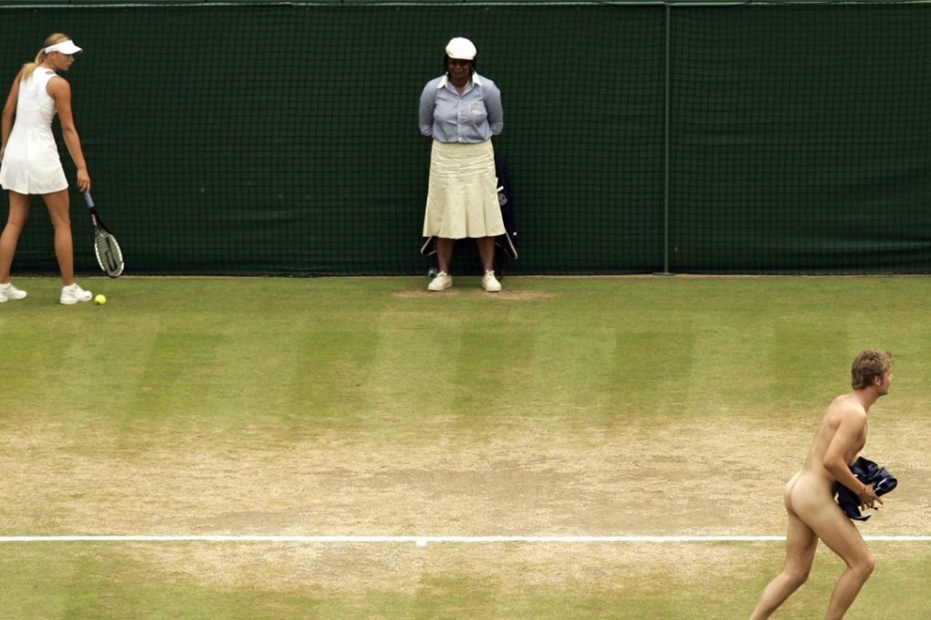 Russia's Maria Sharapova (left) watches a streaker who interrupted her quarter-final match at the Wimbledon tennis championships in London in July 2006. Hong Kong does not have a specific law to deal with indecent exposure at the moment. Photo: Reuters