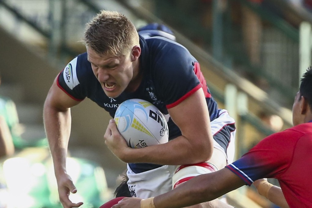 Mike Parfitt breaks the line in Hong Kong’s big win over Malaysia. Photo: Edmond So