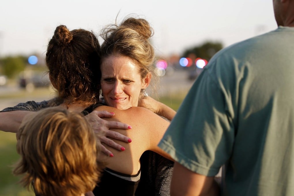 Witnesses outside the scene of a shooting in Oklahoma City. Photo: AP