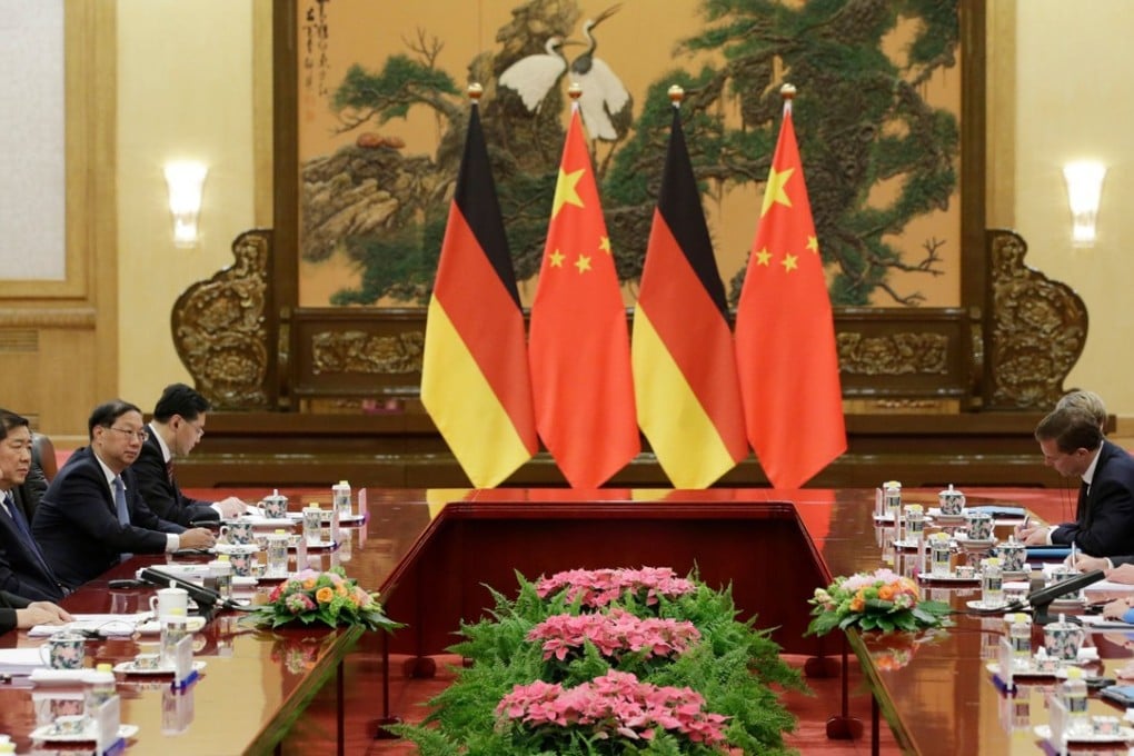 German Chancellor Angela Merkel (right) aimed to improve relations with President Xi Jinping (left) during Merkel’s Beijing visit. Photo: AFP