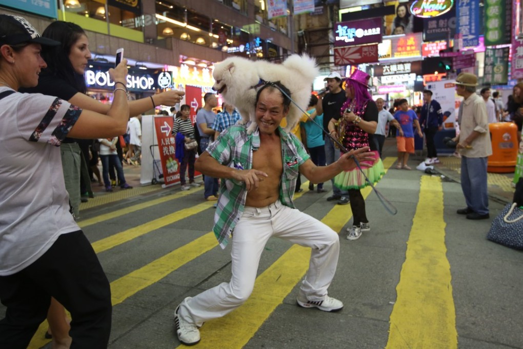 A performer is seen at the Mong Kok pedestrian zone in November 2015. Photo: SCMP