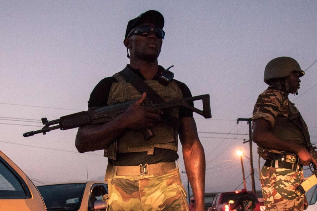 Soldiers of the 21st Motorised Infantry Brigade patrol the streets of Buea in Cameroon. Photo: AFP